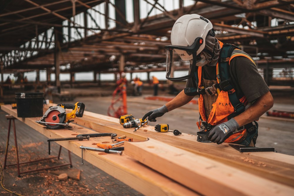 Builder working with power tools on a job site