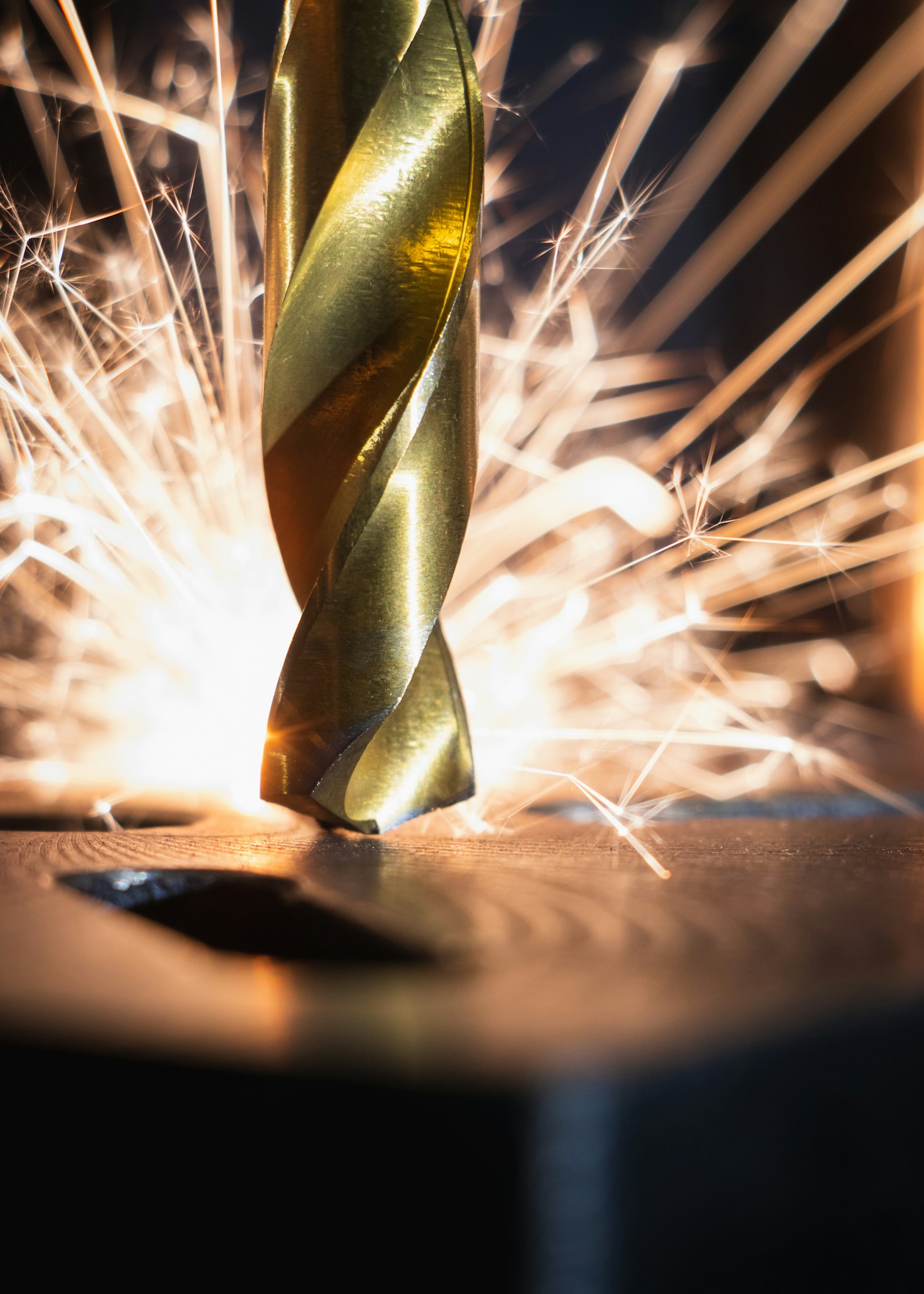 Drill bit cutting metal with sparks